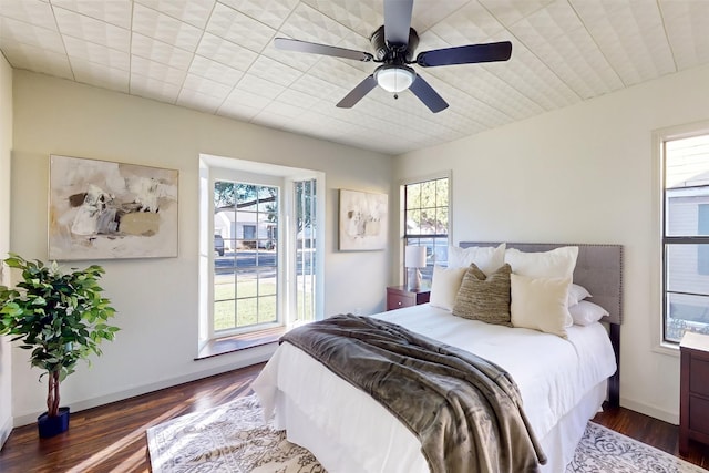 2842 Carlson Dr, Dallas, TX 75235 - bedroom with multiple windows, dark hardwood / wood-style floors, and ceiling fan