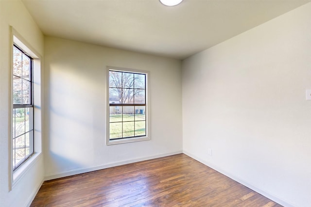 2842 Carlson Dr, Dallas, TX 75235 - spare room featuring dark hardwood / wood-style flooring