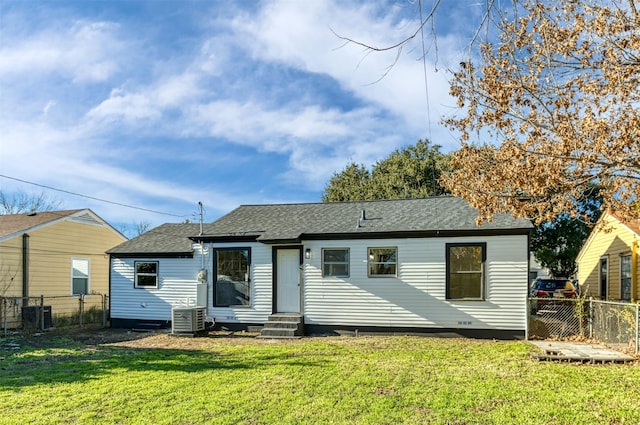 2842 Carlson Dr, Dallas, TX 75235 - back of house with cooling unit and a lawn