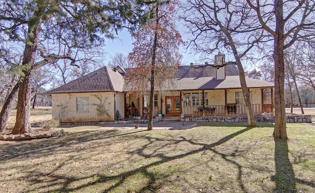 view of front of home with a front lawn and a porch