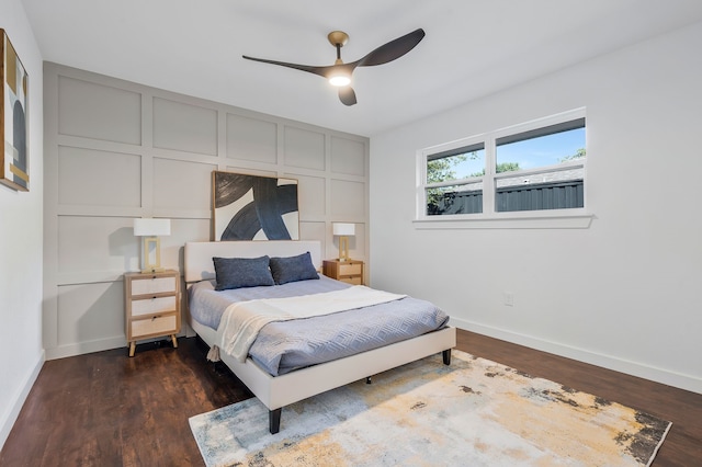 bedroom with dark wood-type flooring and ceiling fan