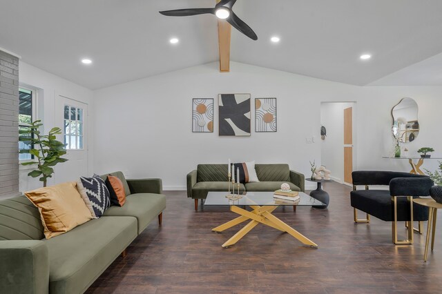 living room featuring dark wood-type flooring, lofted ceiling with beams, and ceiling fan