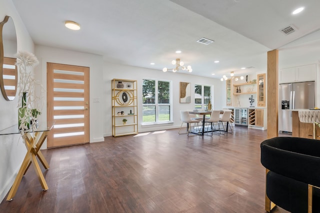 dining room featuring hardwood / wood-style floors and a notable chandelier