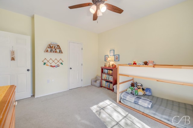 interior space with light colored carpet and ceiling fan