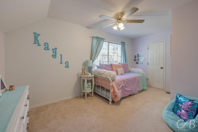 bedroom with lofted ceiling, light colored carpet, and ceiling fan