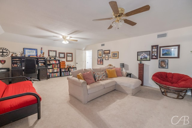 carpeted living room featuring ceiling fan