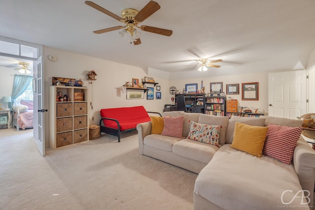 carpeted living room with ceiling fan