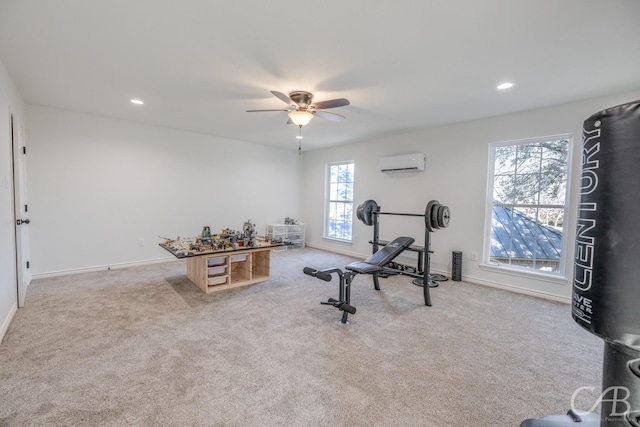 exercise room with a wall mounted air conditioner, light colored carpet, and ceiling fan