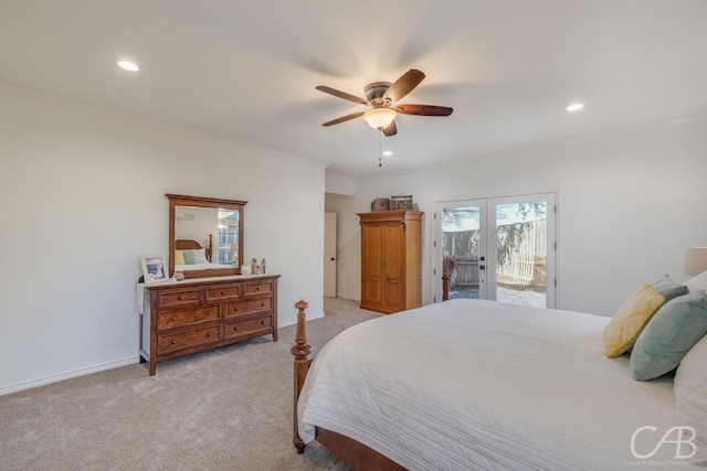 bedroom featuring ornamental molding, light colored carpet, access to exterior, ceiling fan, and french doors