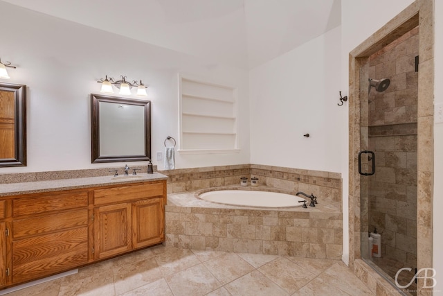 bathroom featuring vanity, tile patterned flooring, built in shelves, and plus walk in shower