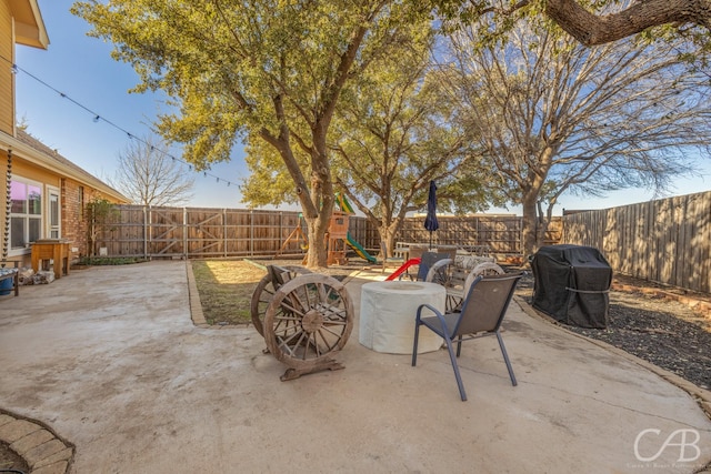 view of patio / terrace with area for grilling and a playground