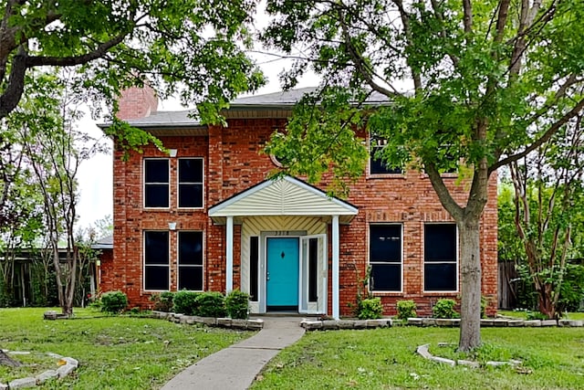 view of front of house with a front lawn