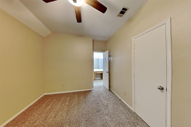 unfurnished room featuring lofted ceiling, light carpet, and ceiling fan