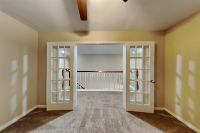 carpeted empty room with french doors