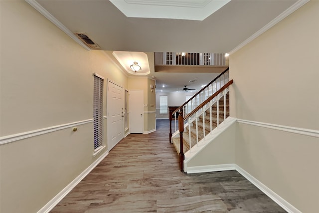 interior space with crown molding and wood-type flooring