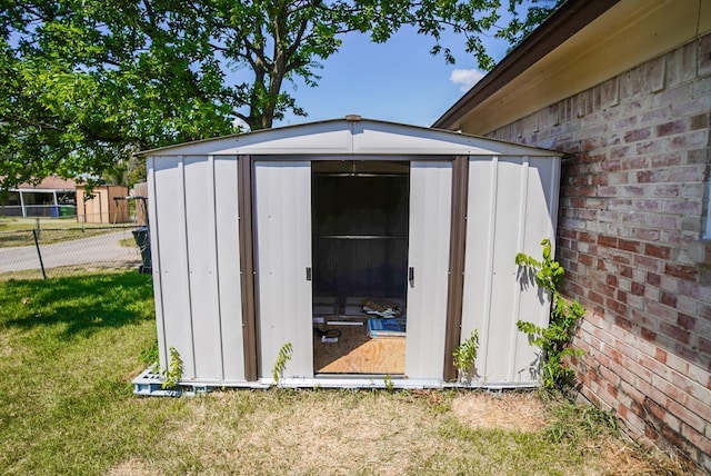 view of outbuilding with a lawn