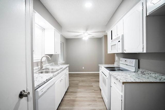 kitchen featuring sink, white cabinetry, light wood-type flooring, ceiling fan, and white appliances