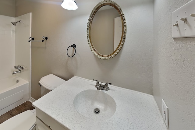 full bathroom with vanity, shower / bathtub combination, and toilet