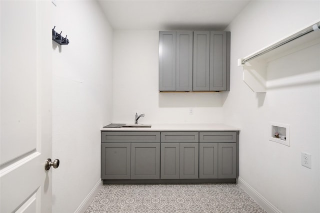 laundry room with cabinets, sink, and hookup for a washing machine