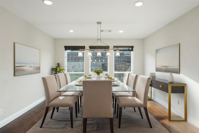 dining area featuring dark wood-type flooring