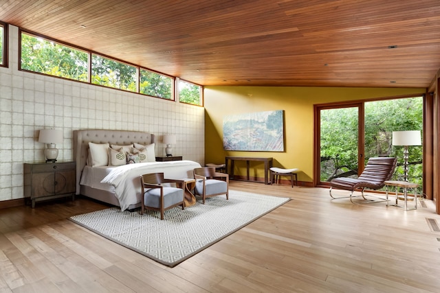 bedroom featuring multiple windows, wood ceiling, and light wood-type flooring