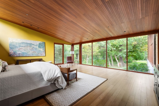 bedroom with hardwood / wood-style flooring, wooden ceiling, and floor to ceiling windows