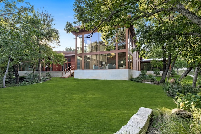 view of yard featuring a sunroom