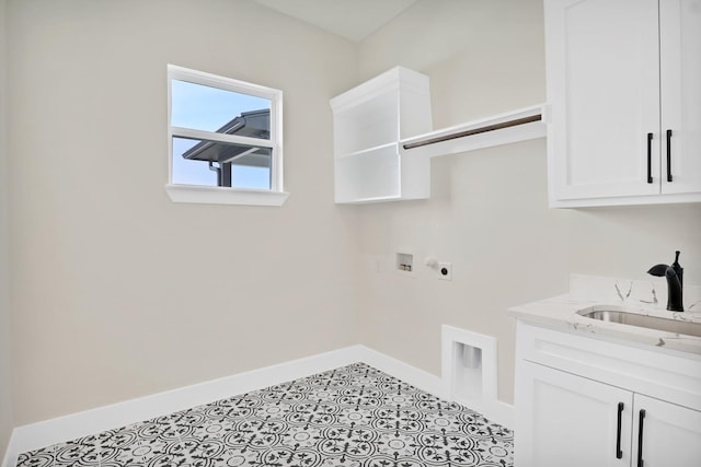 laundry room with sink, light tile patterned floors, hookup for a washing machine, cabinets, and hookup for an electric dryer