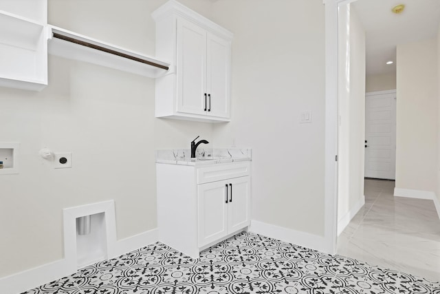 washroom featuring sink, cabinets, hookup for a gas dryer, washer hookup, and electric dryer hookup