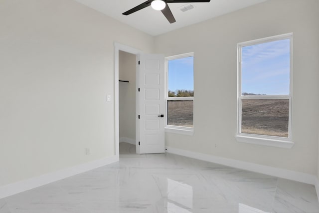 spare room featuring ceiling fan