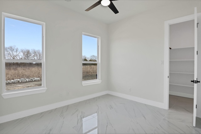 empty room featuring ceiling fan