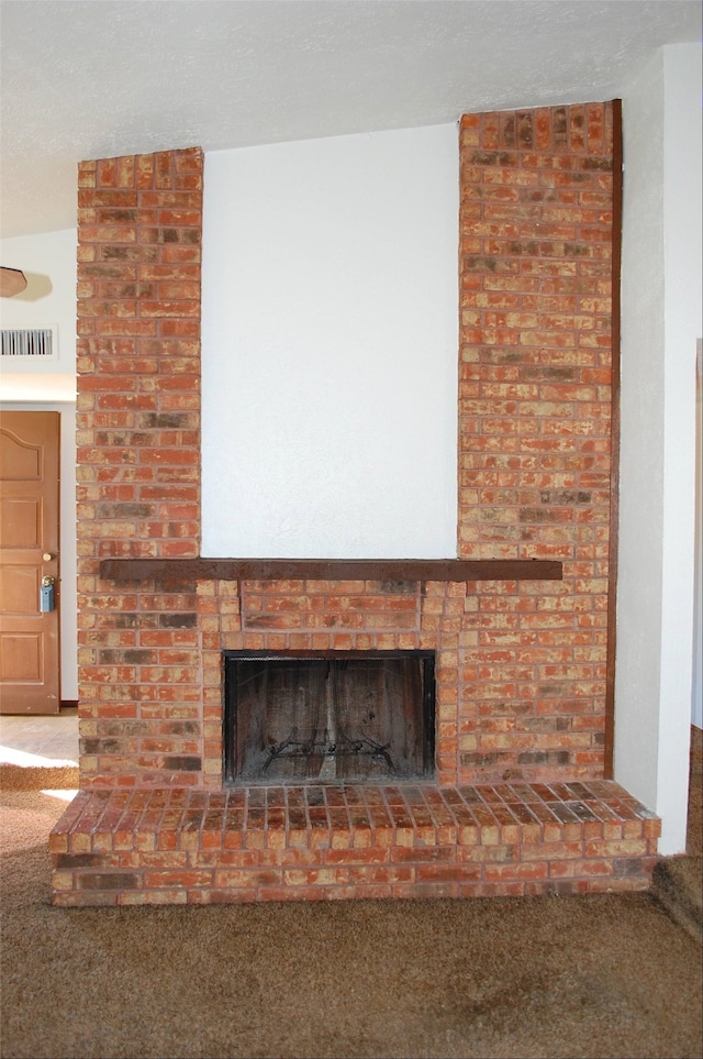 room details with a fireplace and carpet flooring