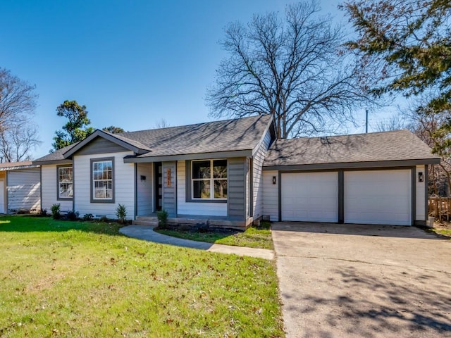 ranch-style home with a garage and a front yard