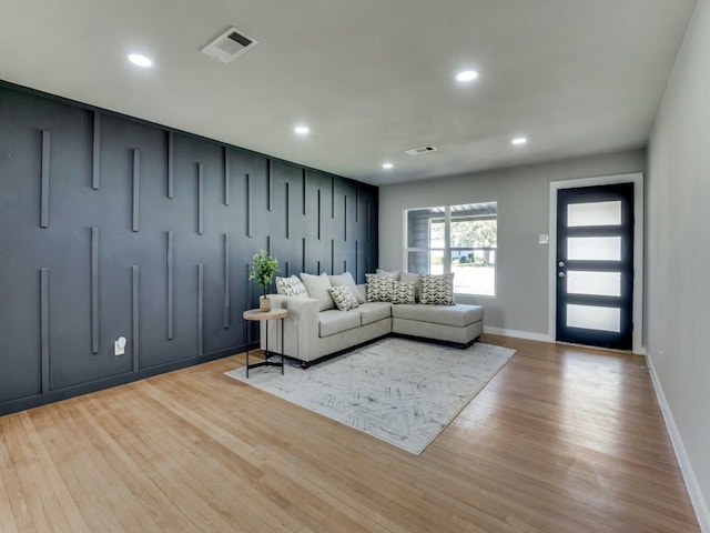 living room with light hardwood / wood-style flooring