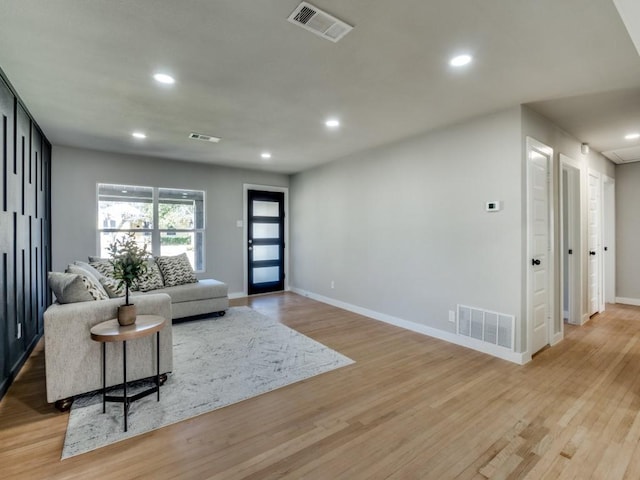 living room with light hardwood / wood-style flooring