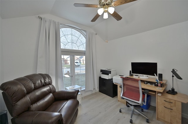 office area featuring ceiling fan, lofted ceiling, and light wood-type flooring