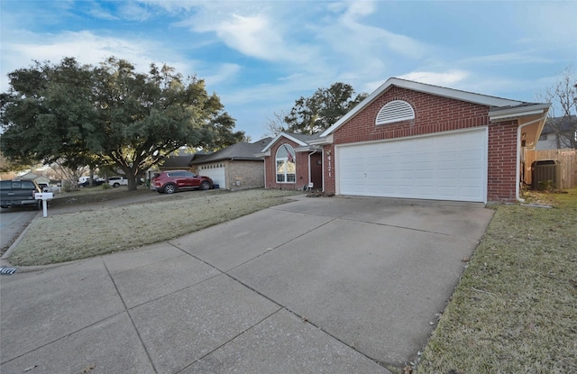 view of front of home with central AC unit and a front lawn