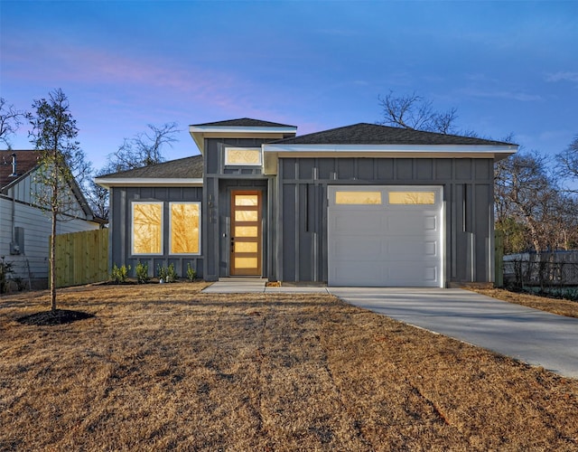 view of front of property with a garage