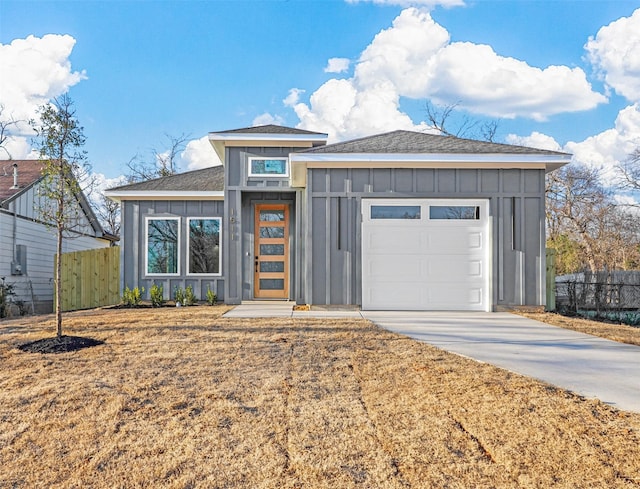 view of front of house with a garage and a front lawn