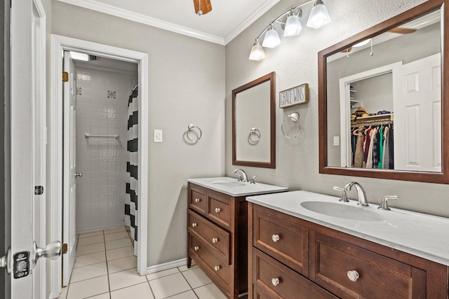 bathroom featuring a shower with shower curtain, ornamental molding, tile patterned flooring, and vanity