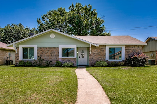 ranch-style house with central AC and a front lawn