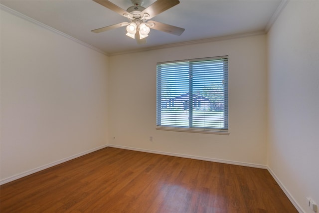 spare room with ceiling fan, ornamental molding, and hardwood / wood-style floors