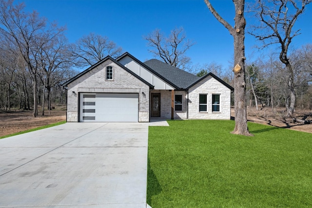 view of front of property with a garage and a front yard