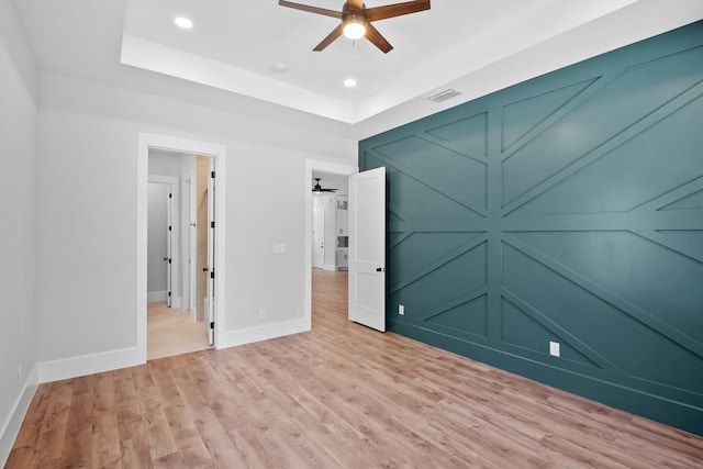 unfurnished bedroom featuring ceiling fan and light hardwood / wood-style flooring