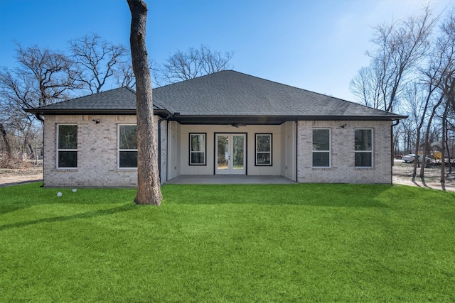 rear view of house with a lawn, ceiling fan, and a patio area