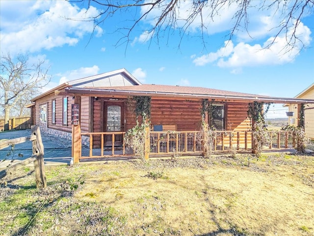 back of property featuring a porch