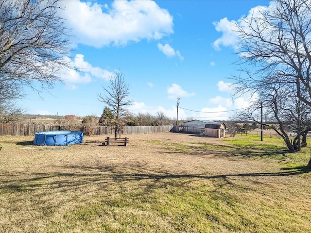 view of yard featuring a covered pool