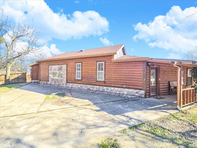 view of side of home featuring a patio area