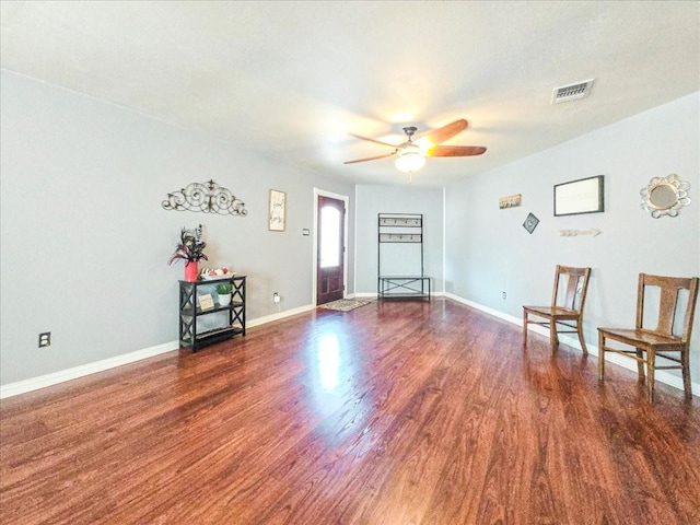 unfurnished room with ceiling fan and dark hardwood / wood-style flooring