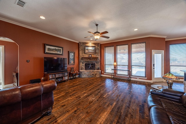 166 Cactus Dr, Decatur, TX 76234 - living area featuring arched walkways, ceiling fan, wood finished floors, and visible vents